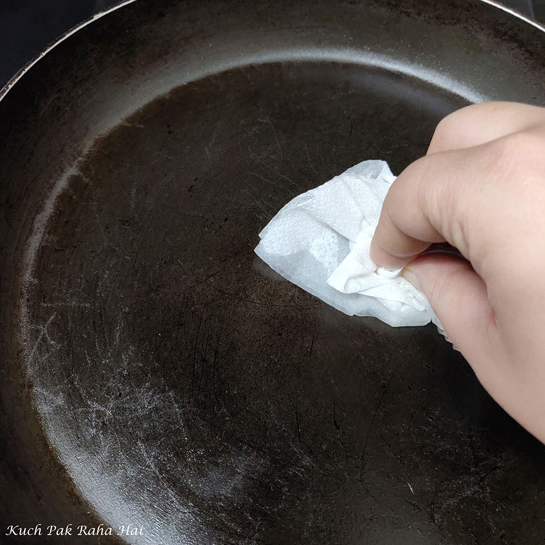 Heating pan to make ragi dosa.