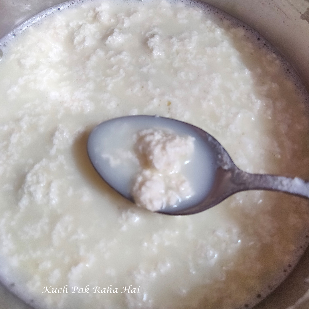 Curdling milk with lemon juice to make paneer.