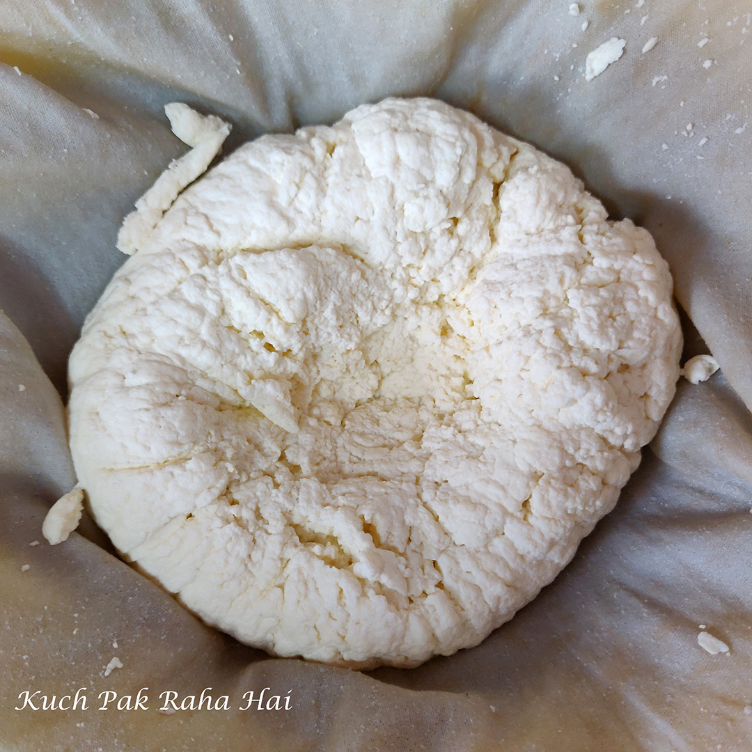 Straining paneer to remove extra moisture.