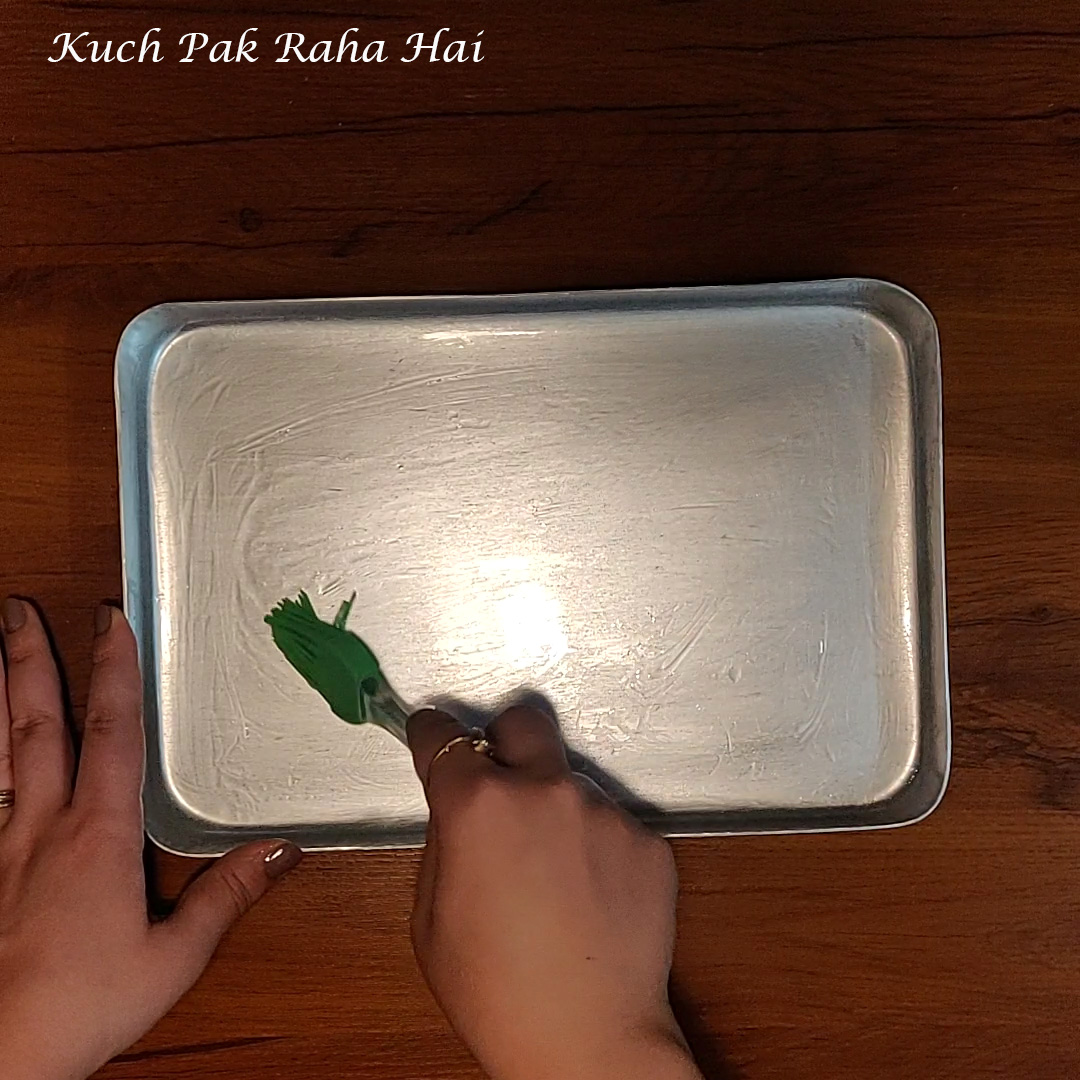 Greasing tray for kalakand.