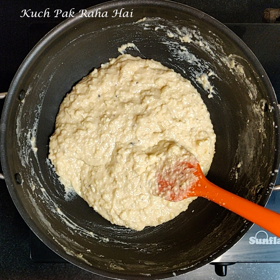 Kalakand mixture begins to thicken up in pan.