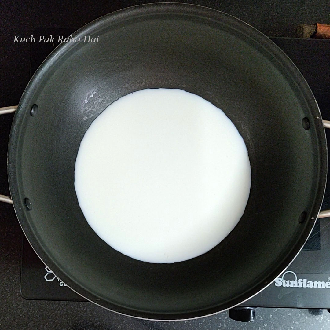 Heating milk in a pan.