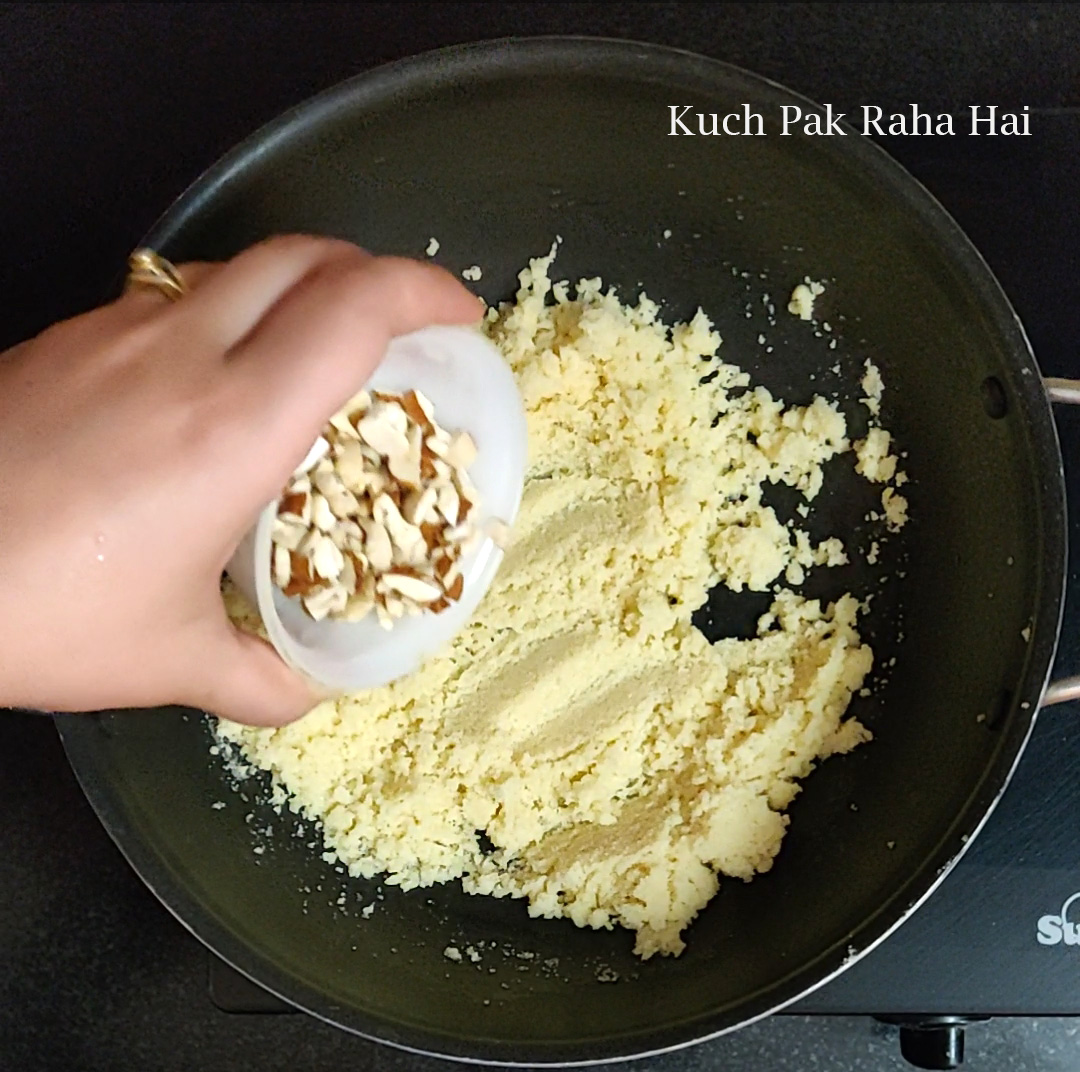 Adding nuts to roasted sooji.