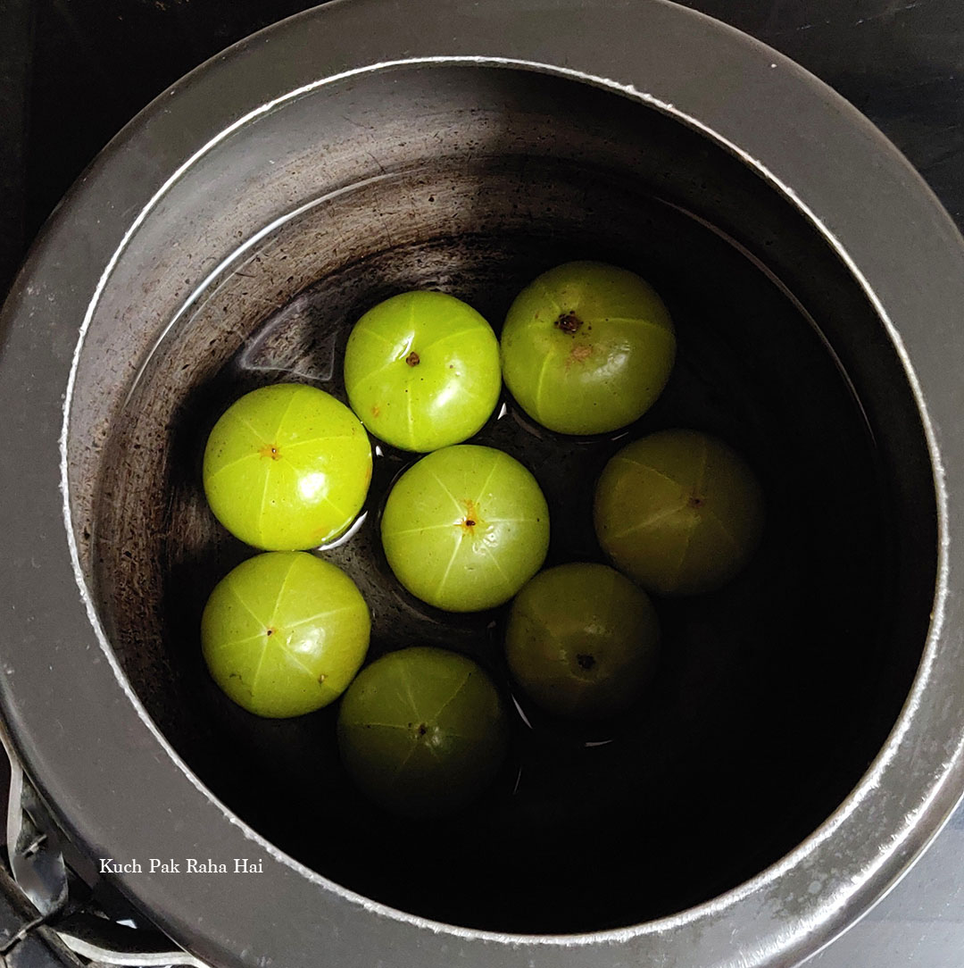 Pressure cooking the amla.