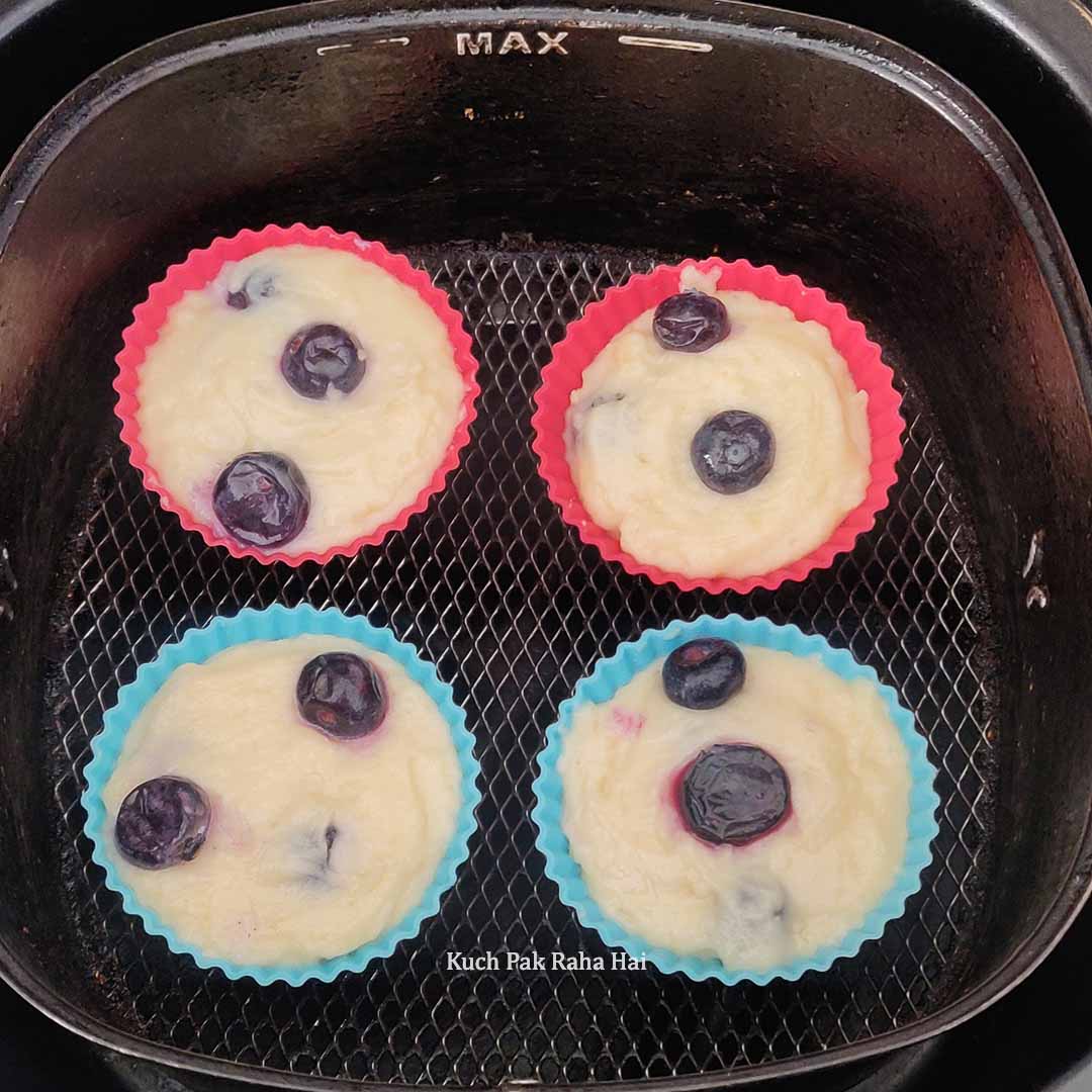 Baking bluberry muffins in air fryer.