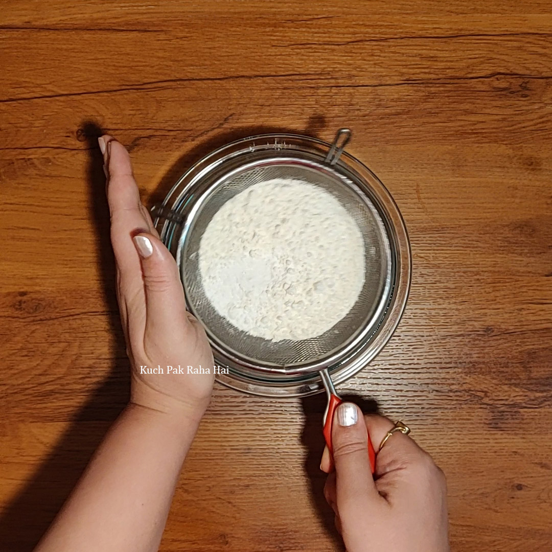 Sifting dry ingredients.