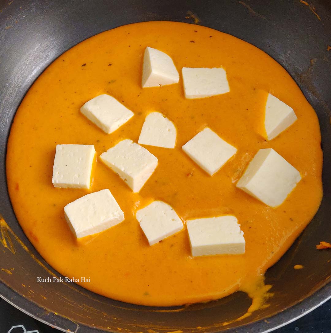 Adding paneer cubes to ready gravy.