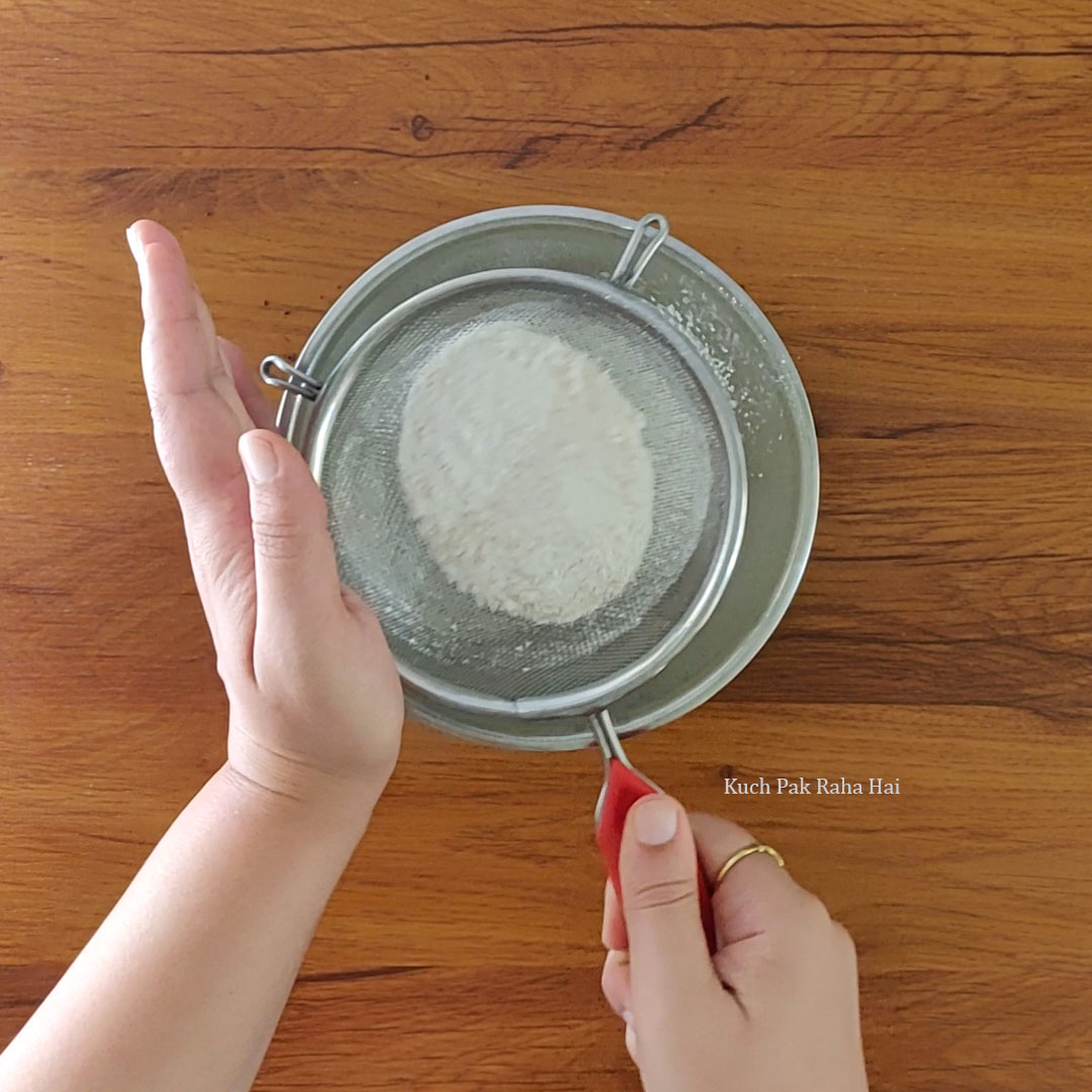 Sieving dry ingredients.