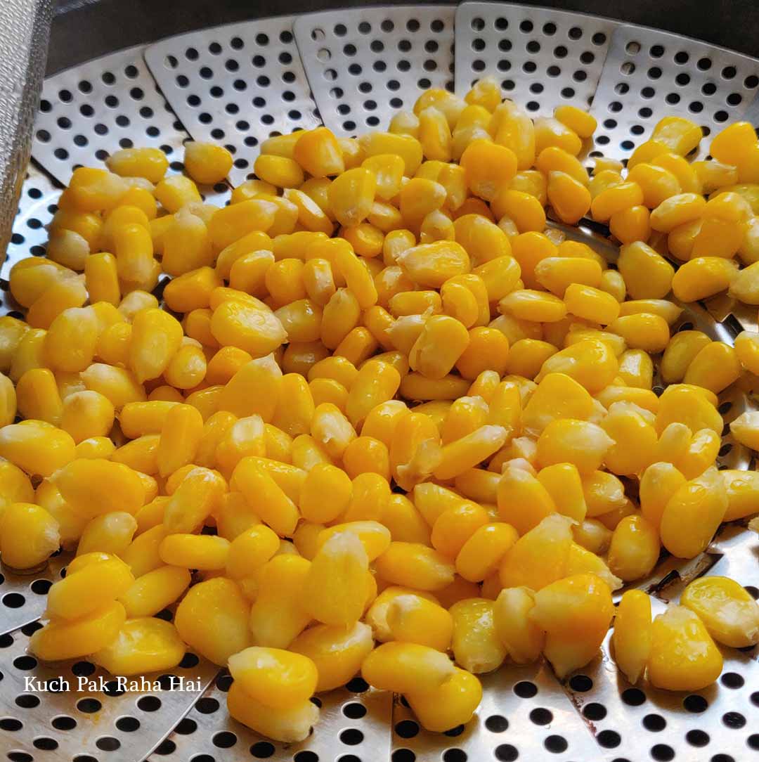 Steaming sweet corn kernels.