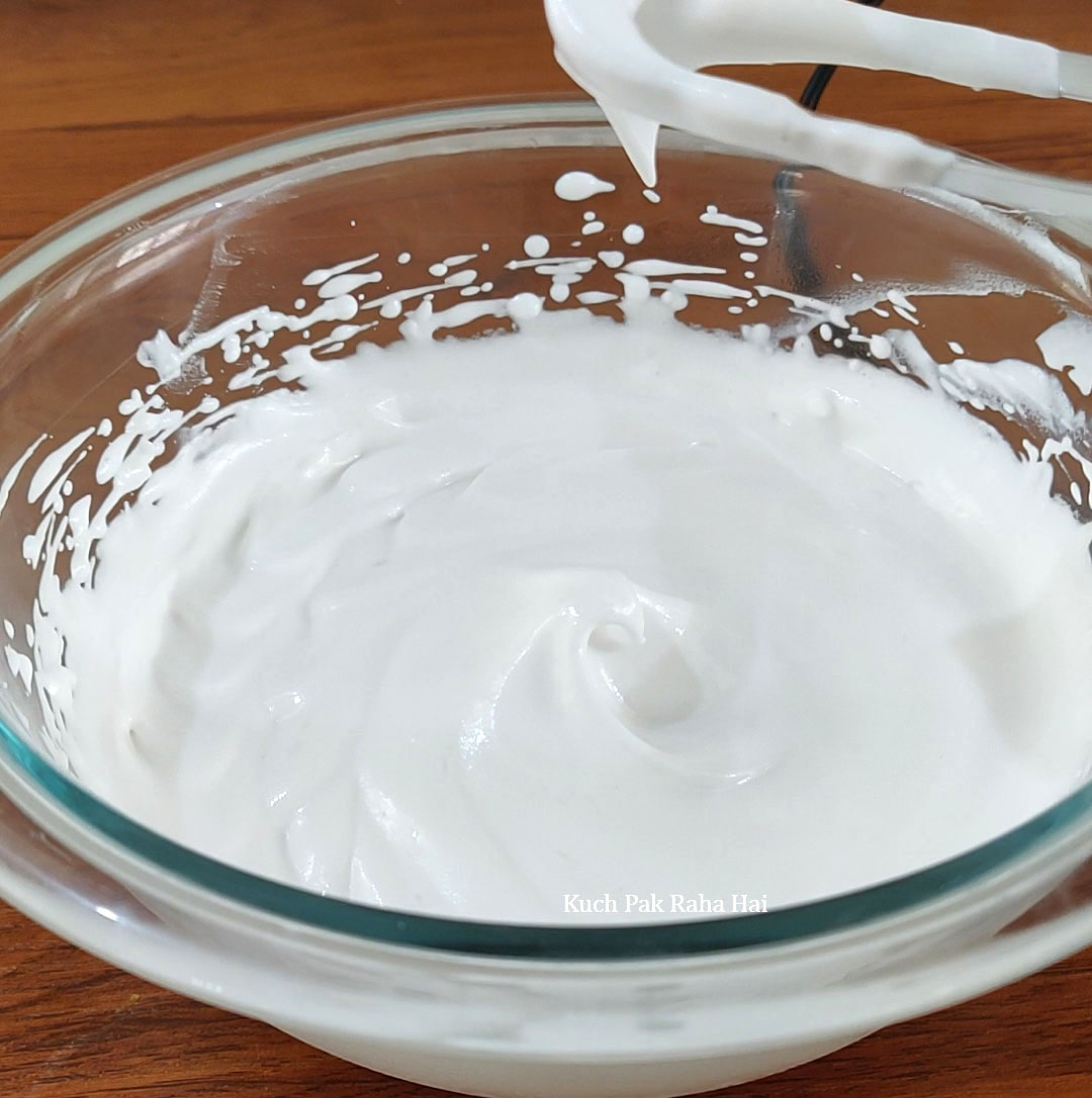 Whipping heavy cream using electric whisker.
