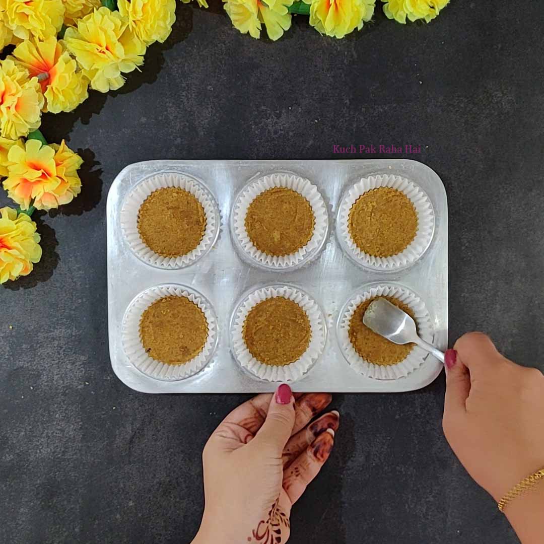 Preparing biscuit crust for cheesecake.