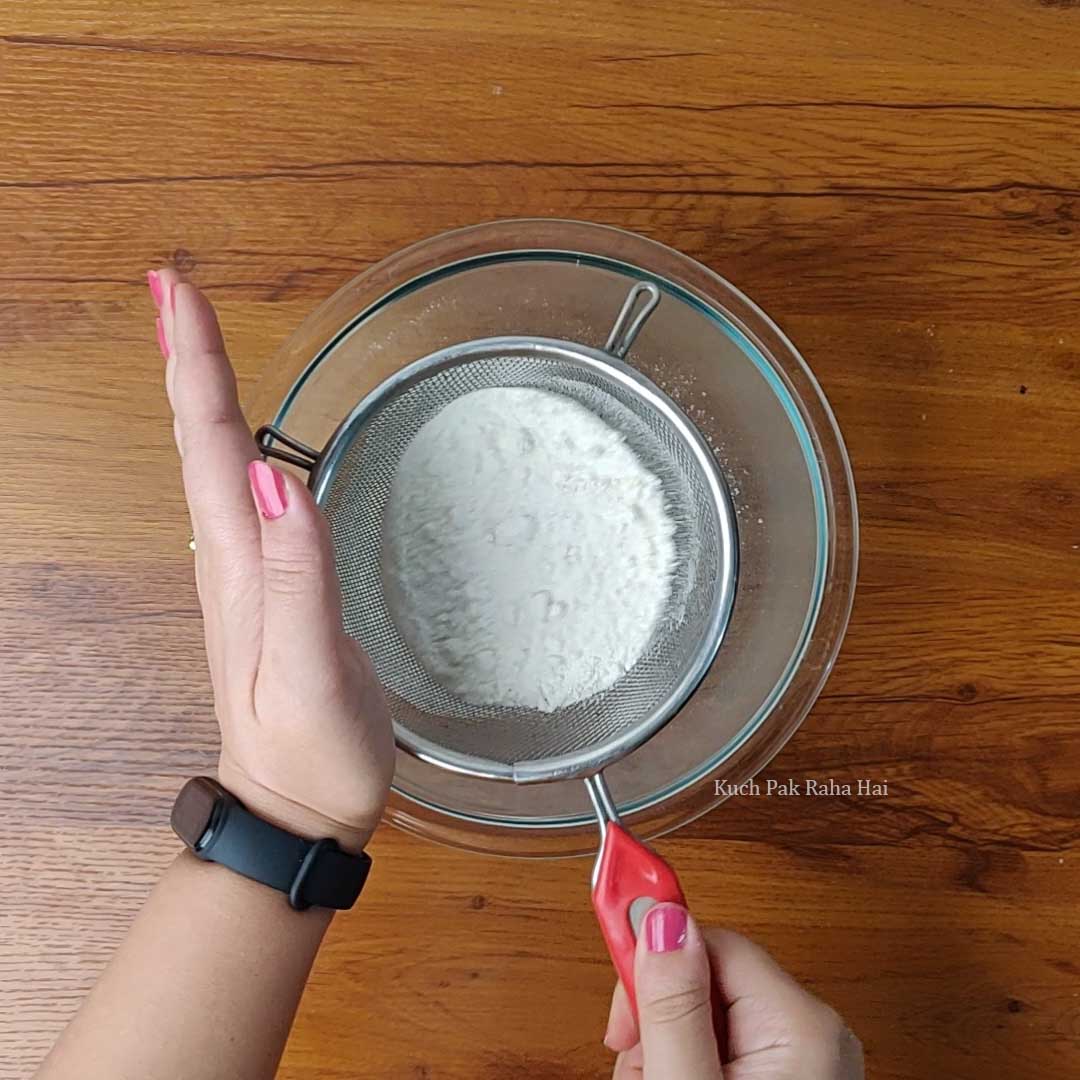 Sieving dry ingredients for making nan khatai.