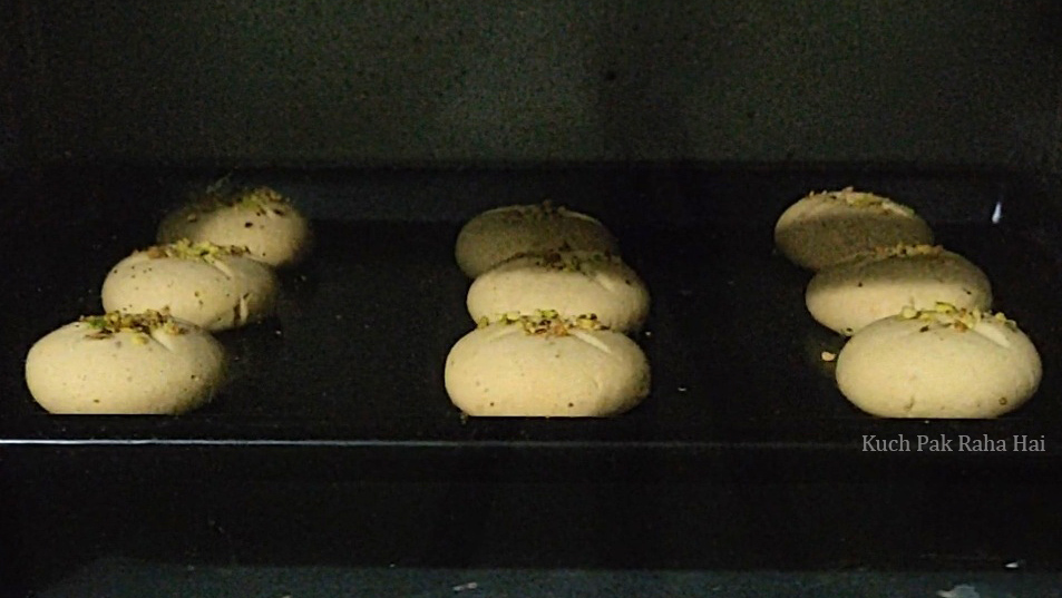 Baking nankhatai in oven.