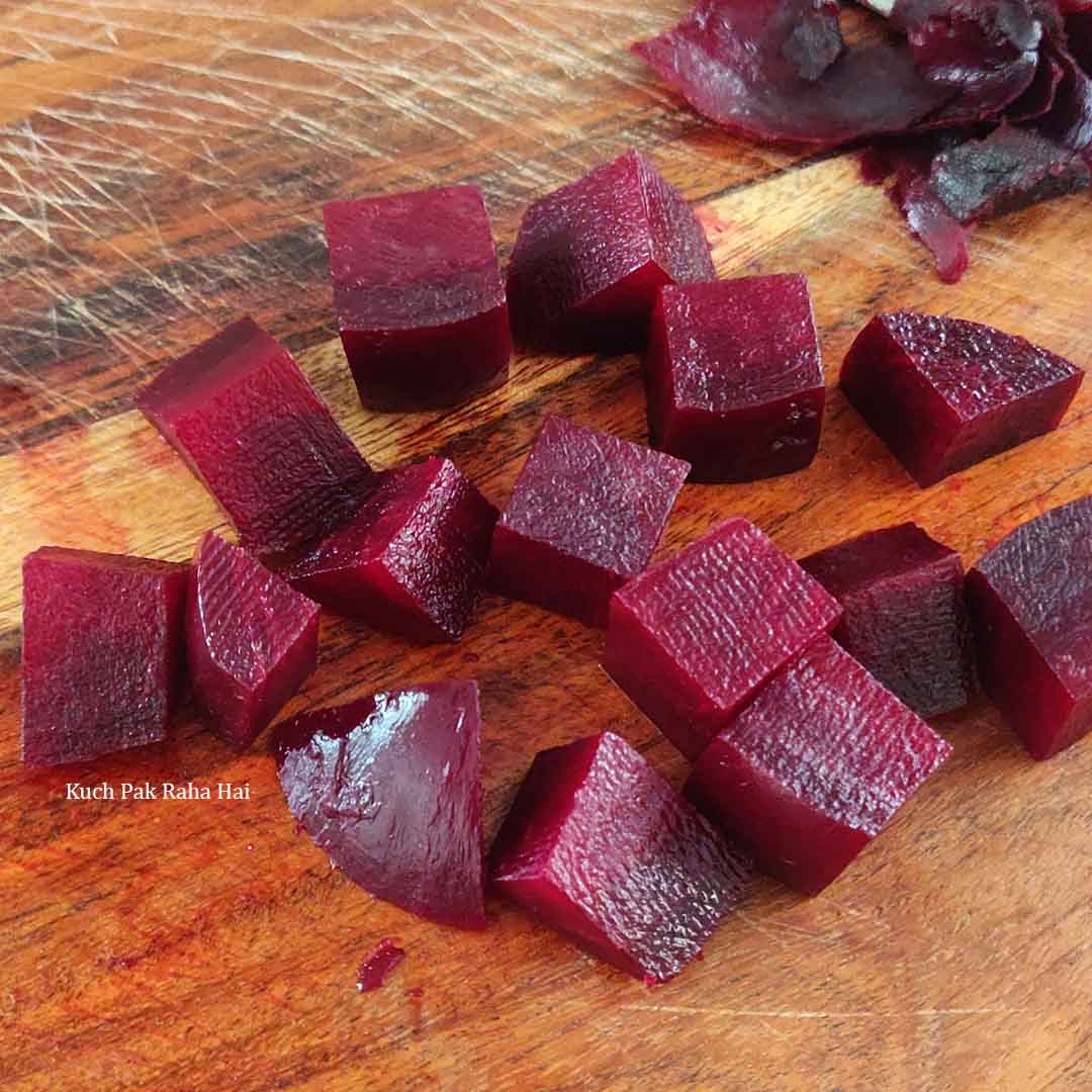 Chopping roasted beetroots in cubes.