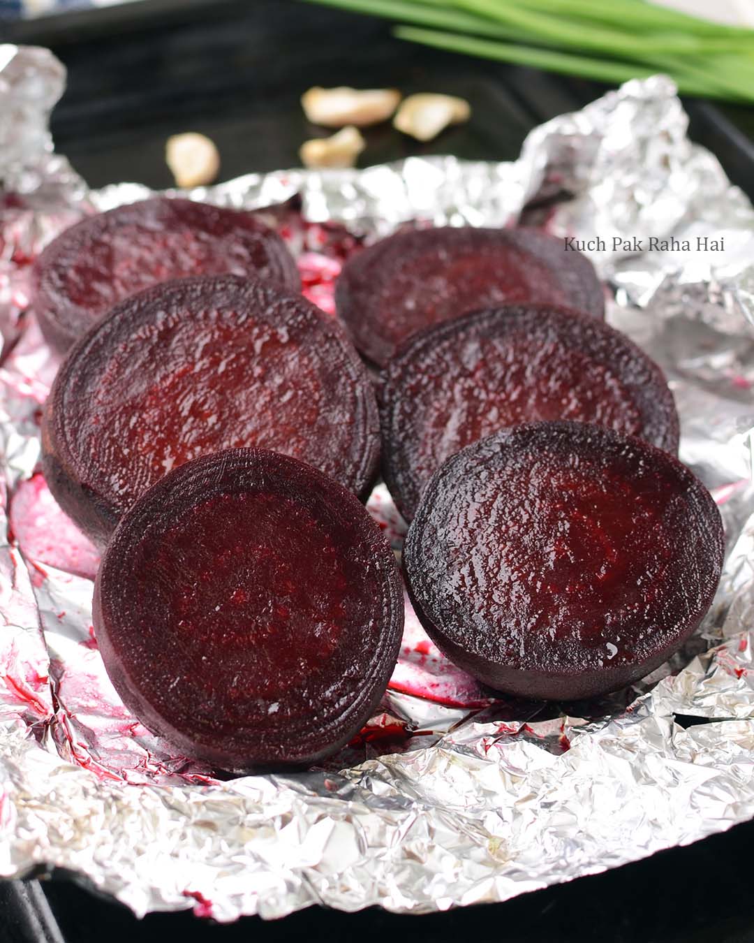 Oven roasted beetroots on baking tray.