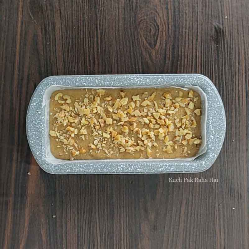 Transferring cake batter in loaf tin