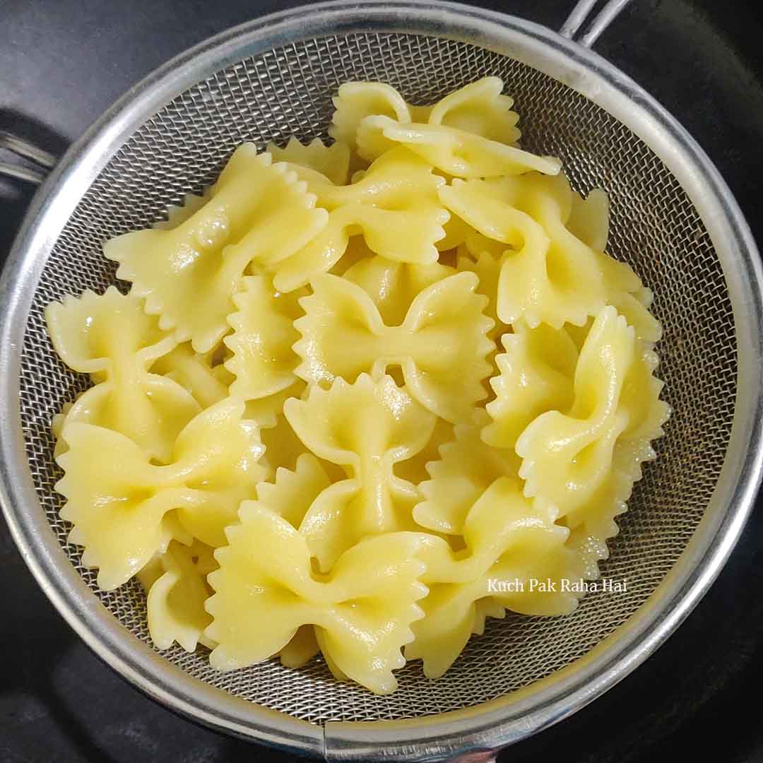 Draining the pasta.