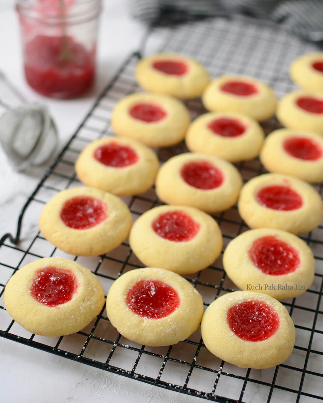 Jam Thumbprint Cookies cooling on a wire rack
