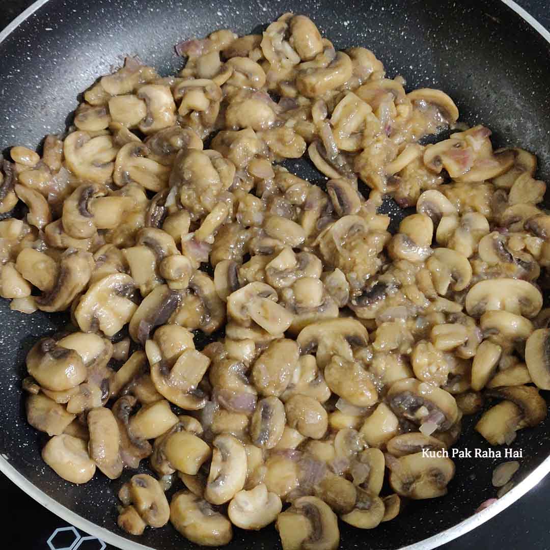 Sautéing mushrooms with onion and garlic.