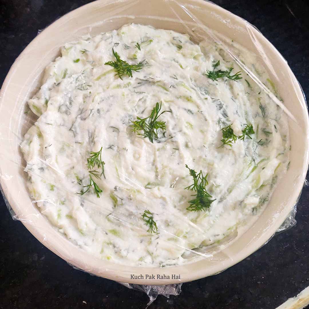 Tzatziki dip bowl wrapped in cling film.