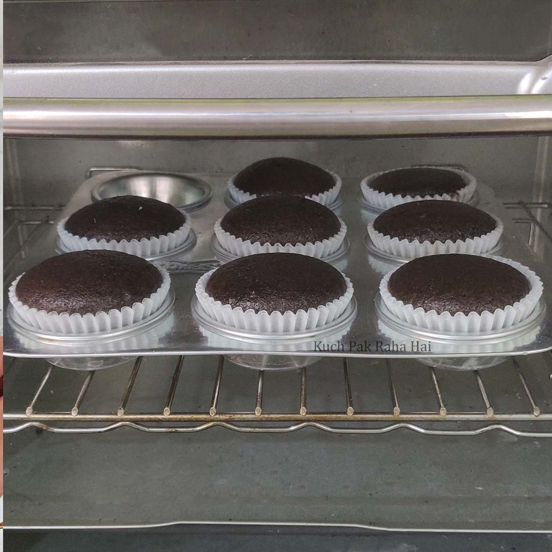 Chocolate cupcakes in oven