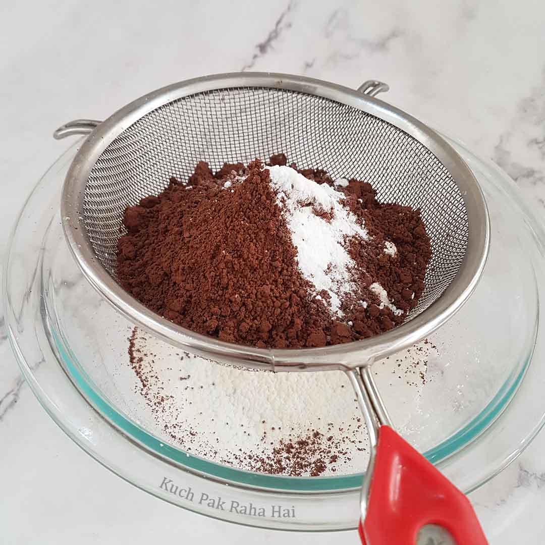 Sieving dry ingredients.