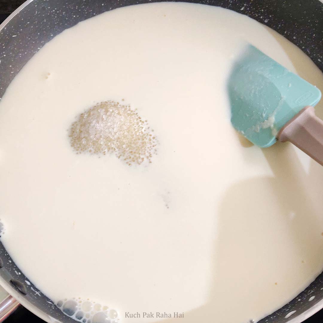 Adding sugar & vanilla to panna cotta mixture.
