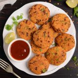 Red lentil fritters (masoor dal vada) served with ketchup.