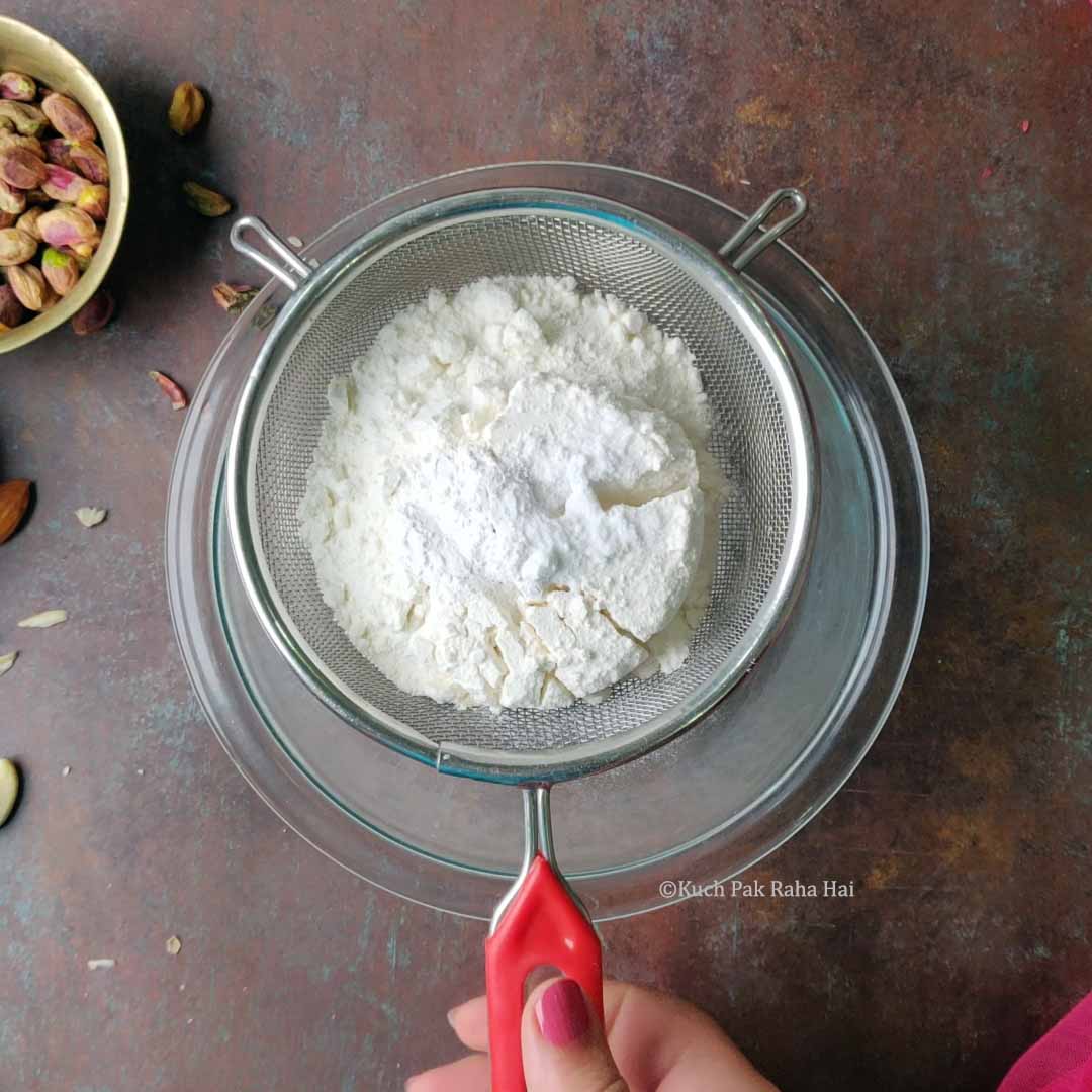 Sieving dry ingredients.