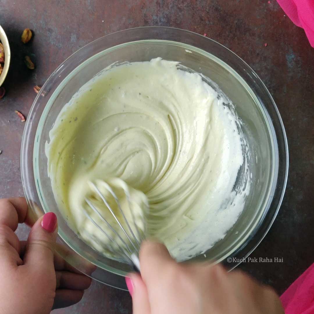 Mixing condensed milk & cardamom.