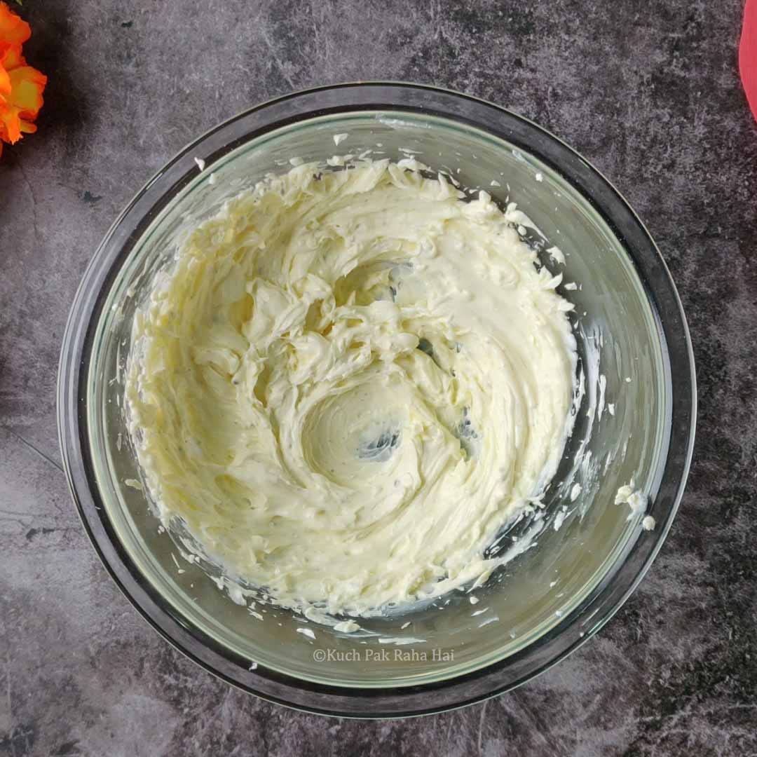 Whisking cream cheese.