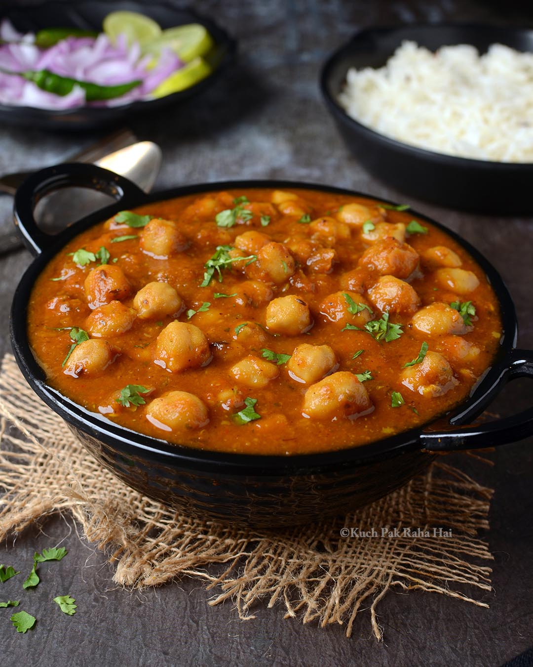 Indian chickpea masala curry served in bowl.