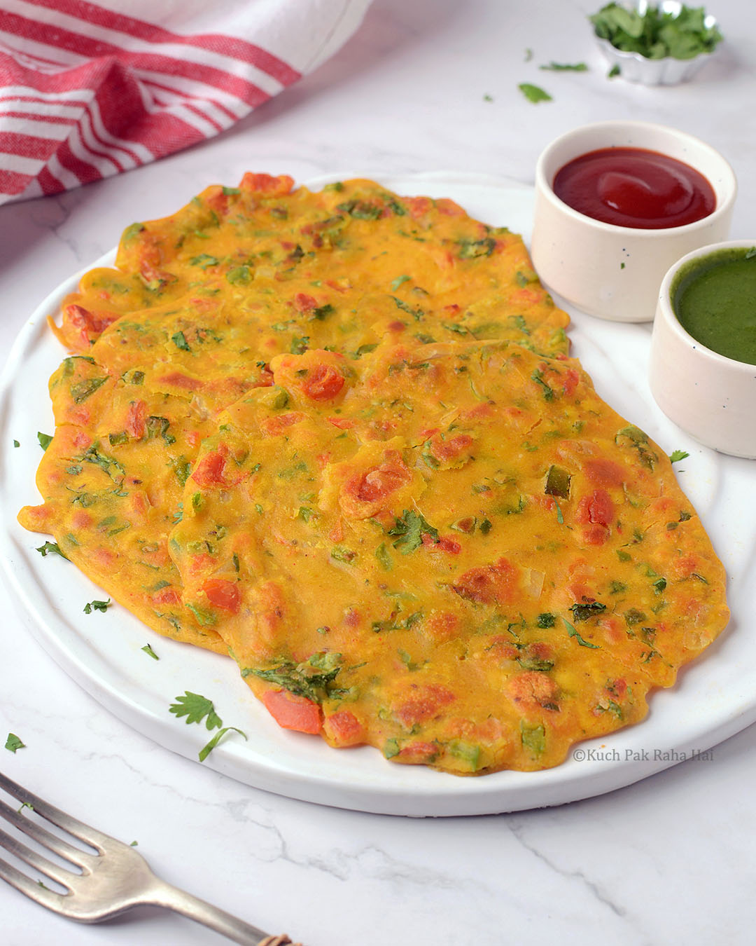 Besan chilla or chickpea flour pancakes with veggies.
