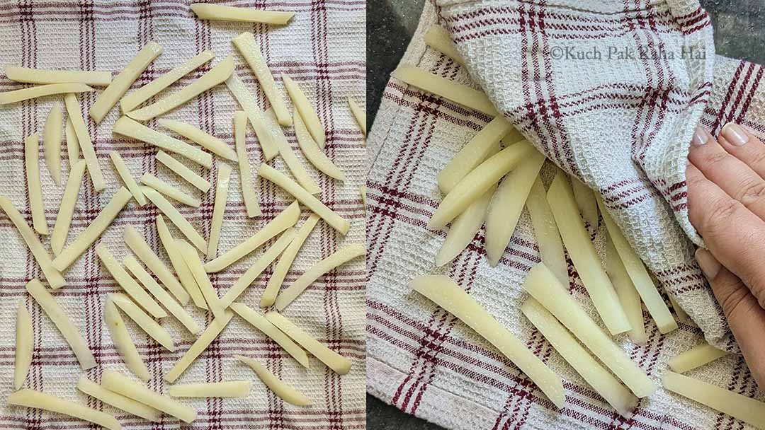 Drying raw french fries on kitchen towel. 