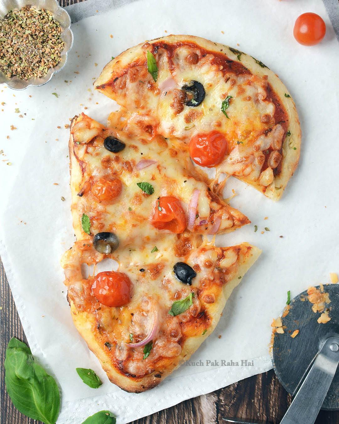 Air fryer naan flatbread pizza cut into slices.
