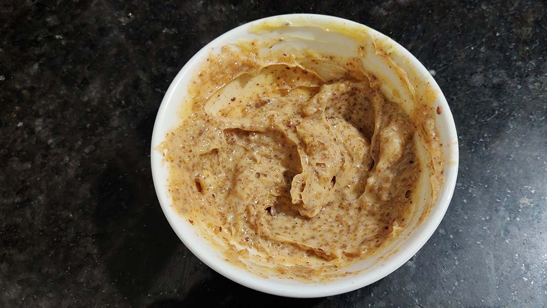 Mixing cinnamon butter sugar in a small bowl.