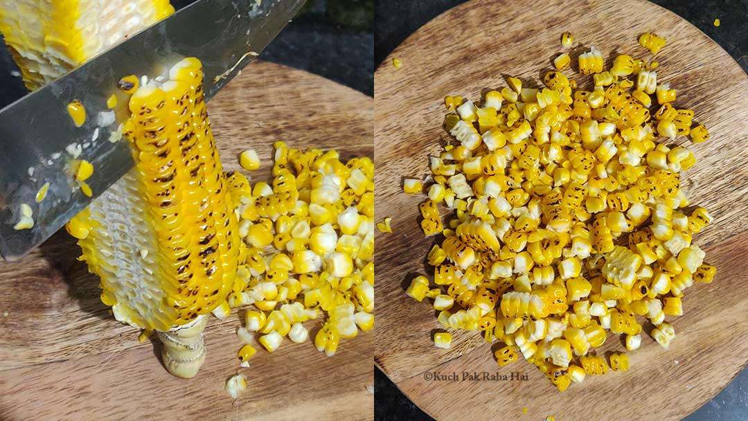 Cutting corn kernels off cob using knife.