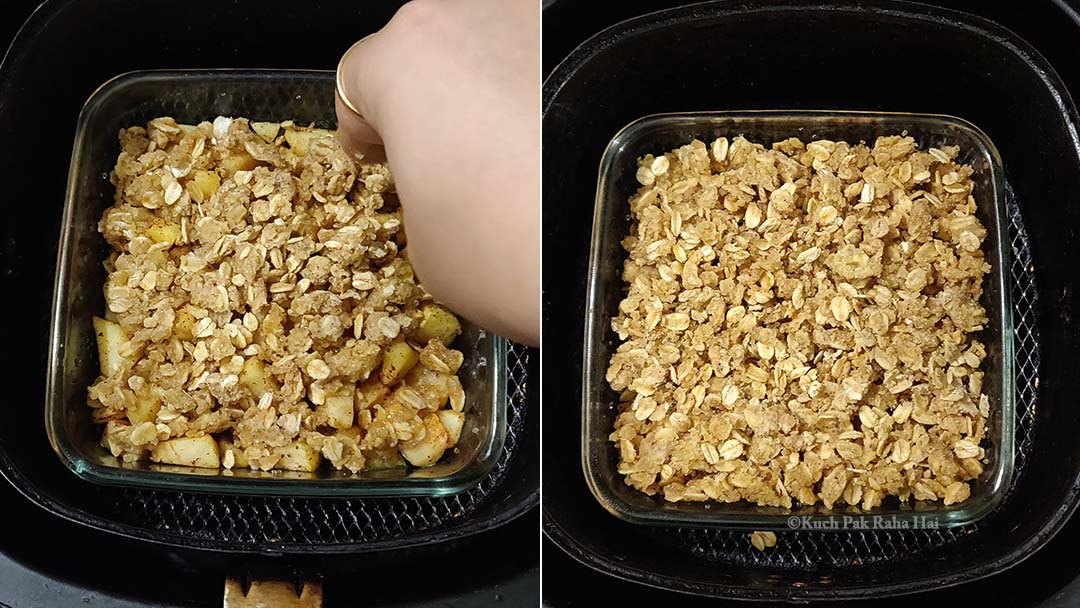 Transferring oats crumble on top of apple filling.