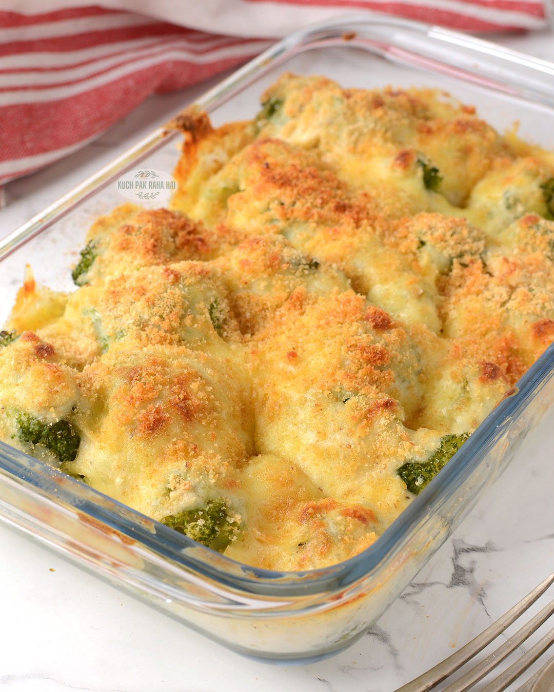 Broccoli Grating with cheddar cheese sauce.