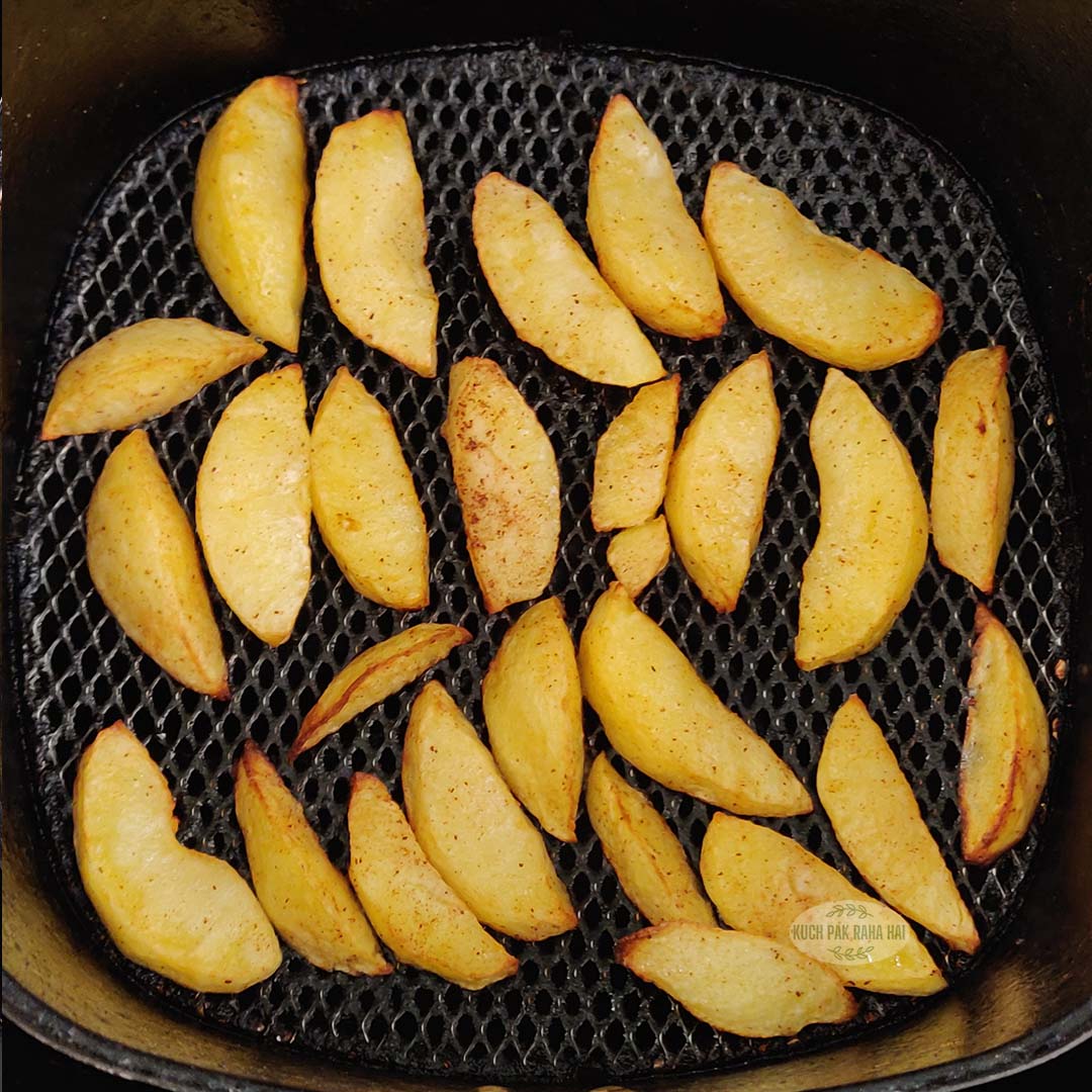 Air fried apple slices in basket.