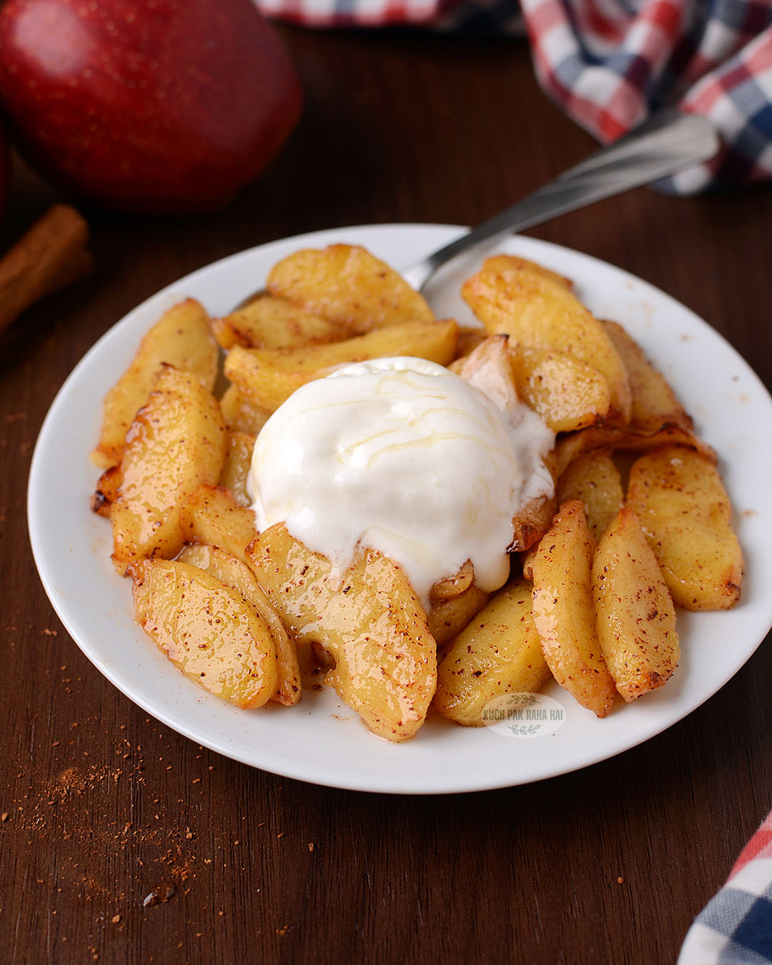 Air fryer apples served with vanilla ice cream.
