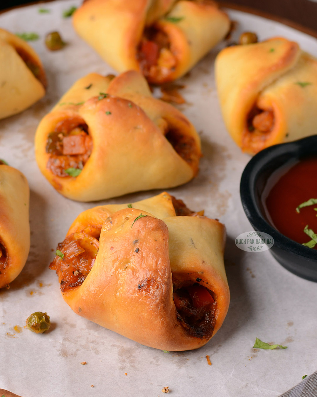 Cheese vegetable parcels served with ketchup.