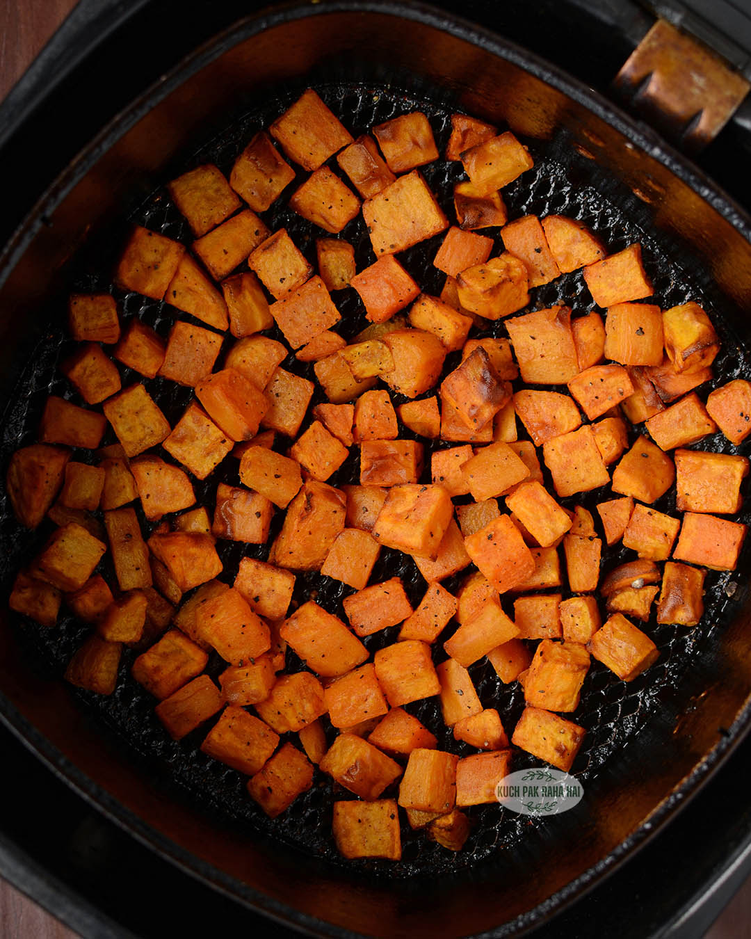 Cubed sweet potatoes in air fryer.