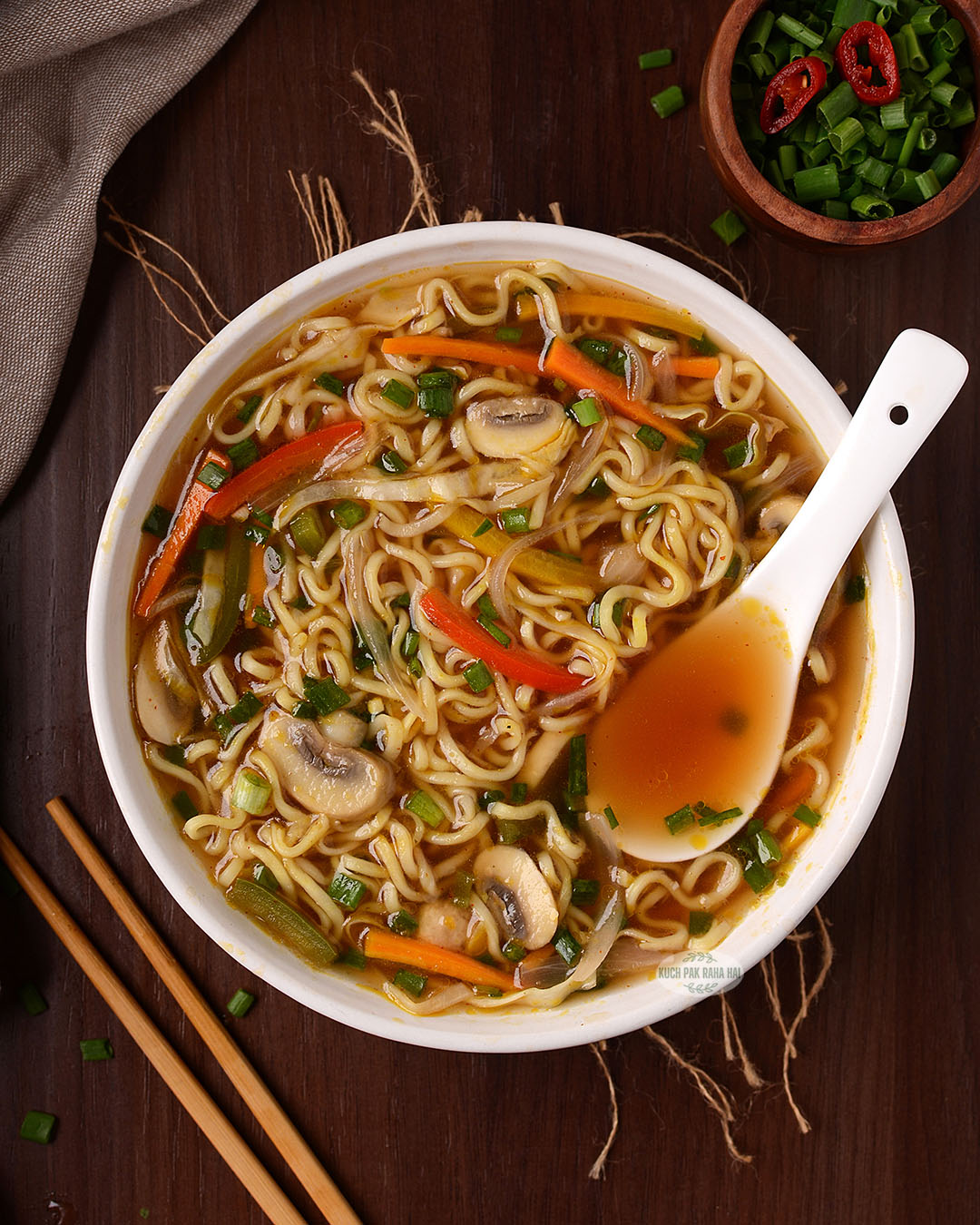 Asian vegetarian noodle soup served in a bowl.