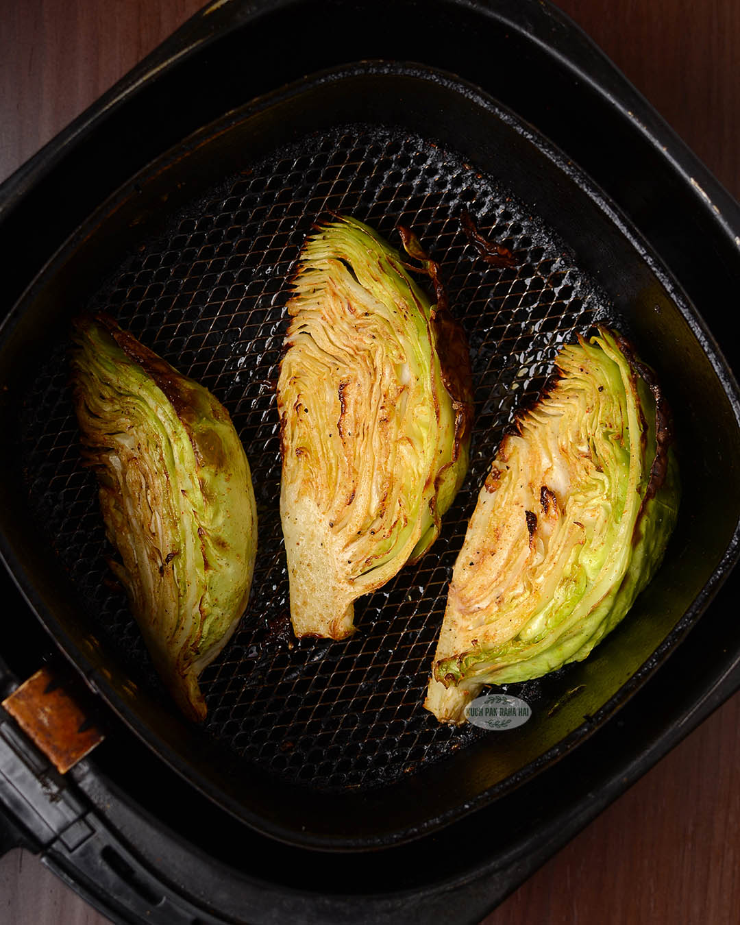 Roasted cabbage slices in air fryer.