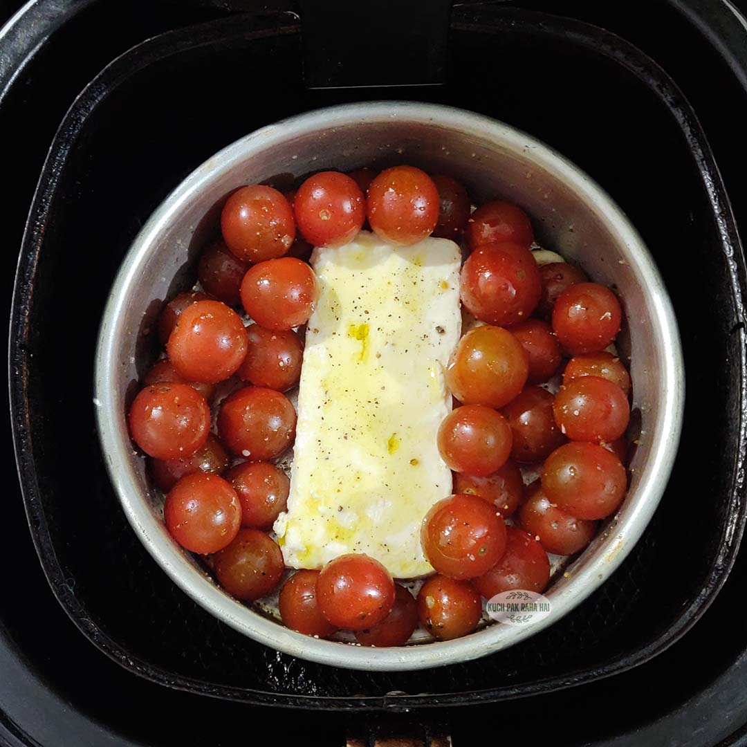 Air frying feta and cherry tomatoes for pasta sauce.