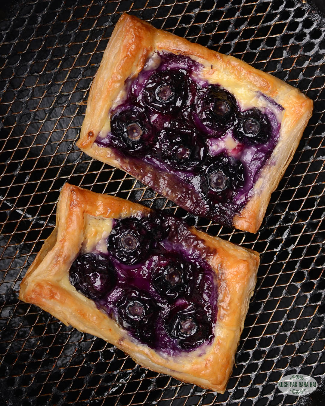 Air fryer puff pastry danish with blueberry and cream cheese.