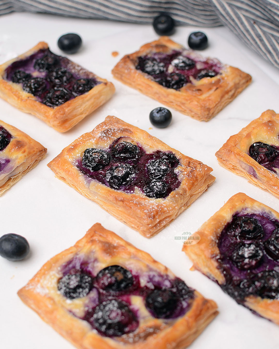 Mini blueberry puff pastry tarts.