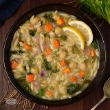Lemon vegetable orzo soup with spinach and chickpea.