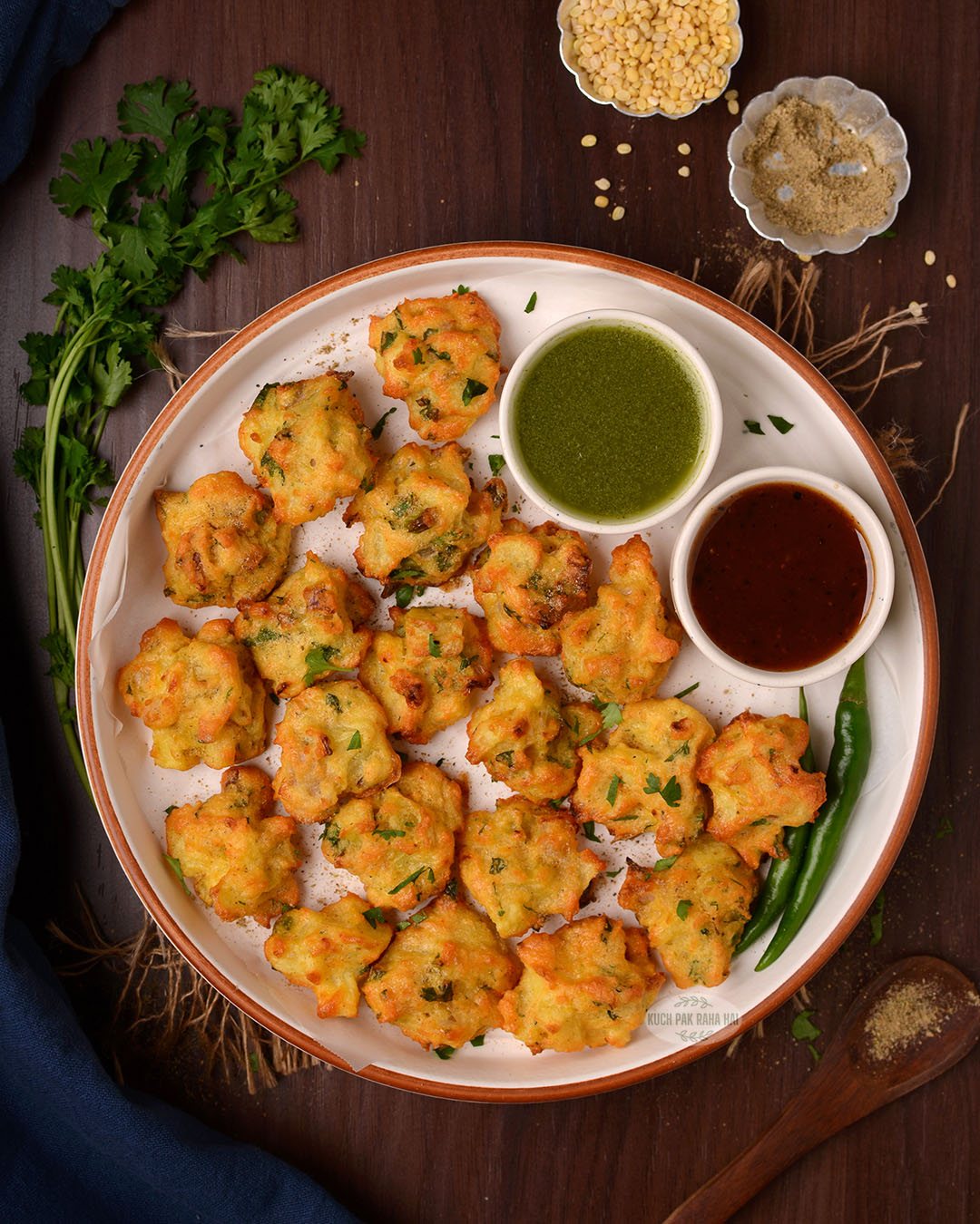 Air fryer moong dal vada served with green chutney and tamarind chutney.
